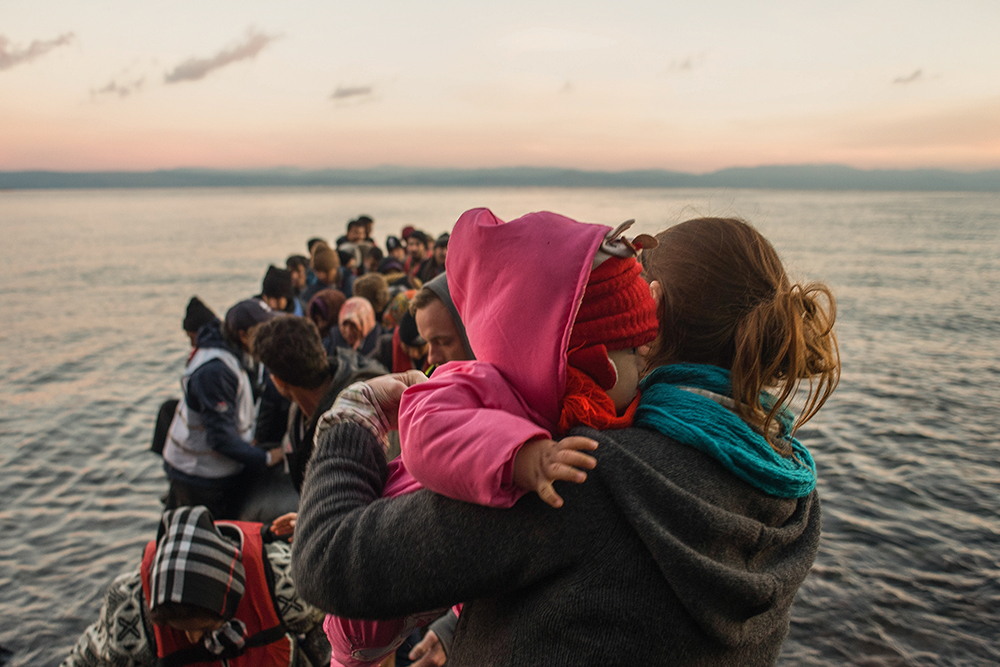 A dinghy arrives in Lesvos, Greece with more than 60 Syrian refugees, most of them children.