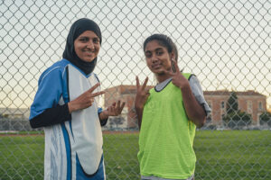 Two girls in soccer gear