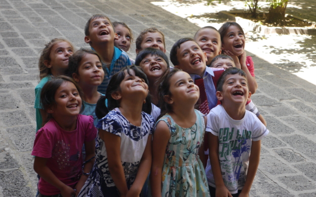 Acev children looking up illustrating early childhood learning