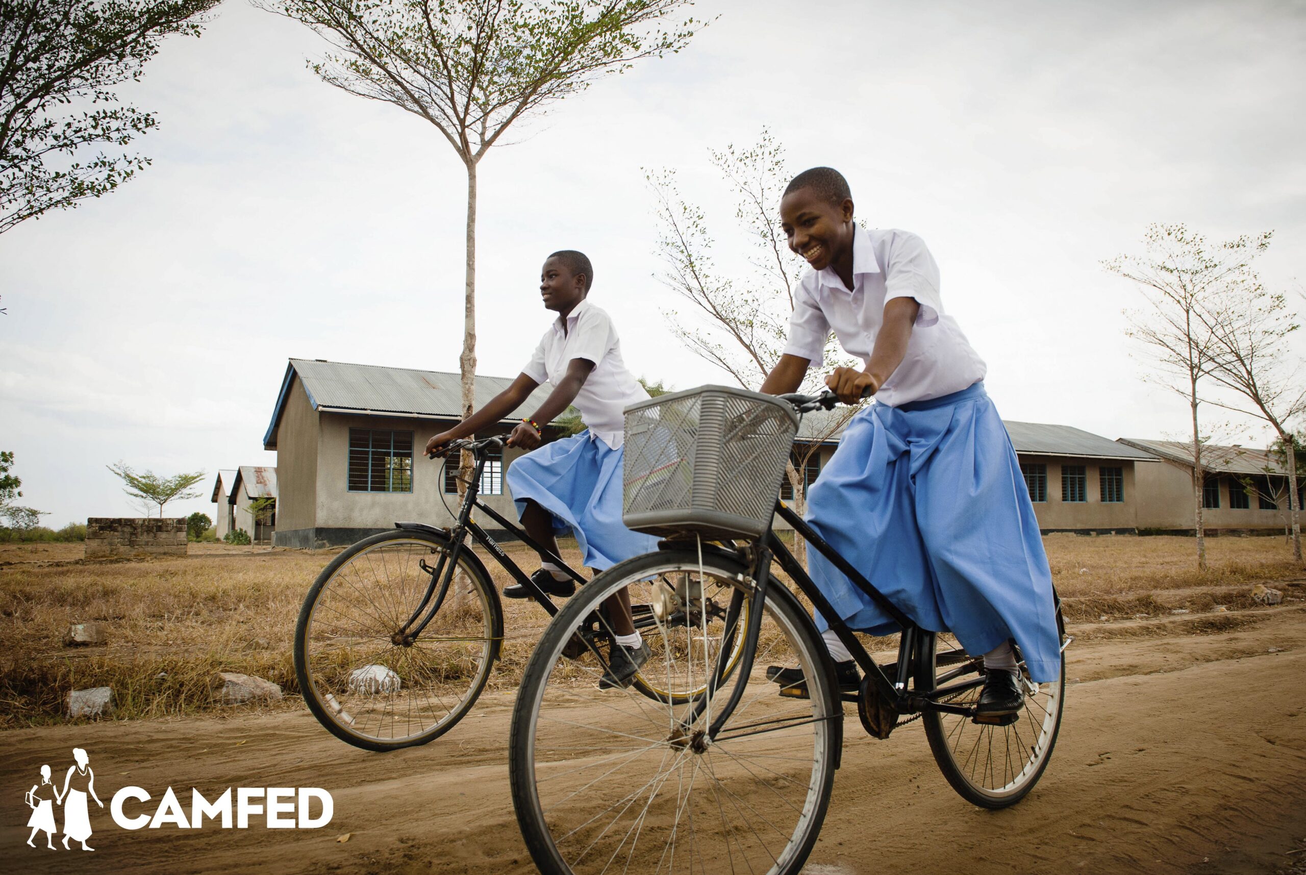 CAMFED scholars Salima and Zawadi on bicycles