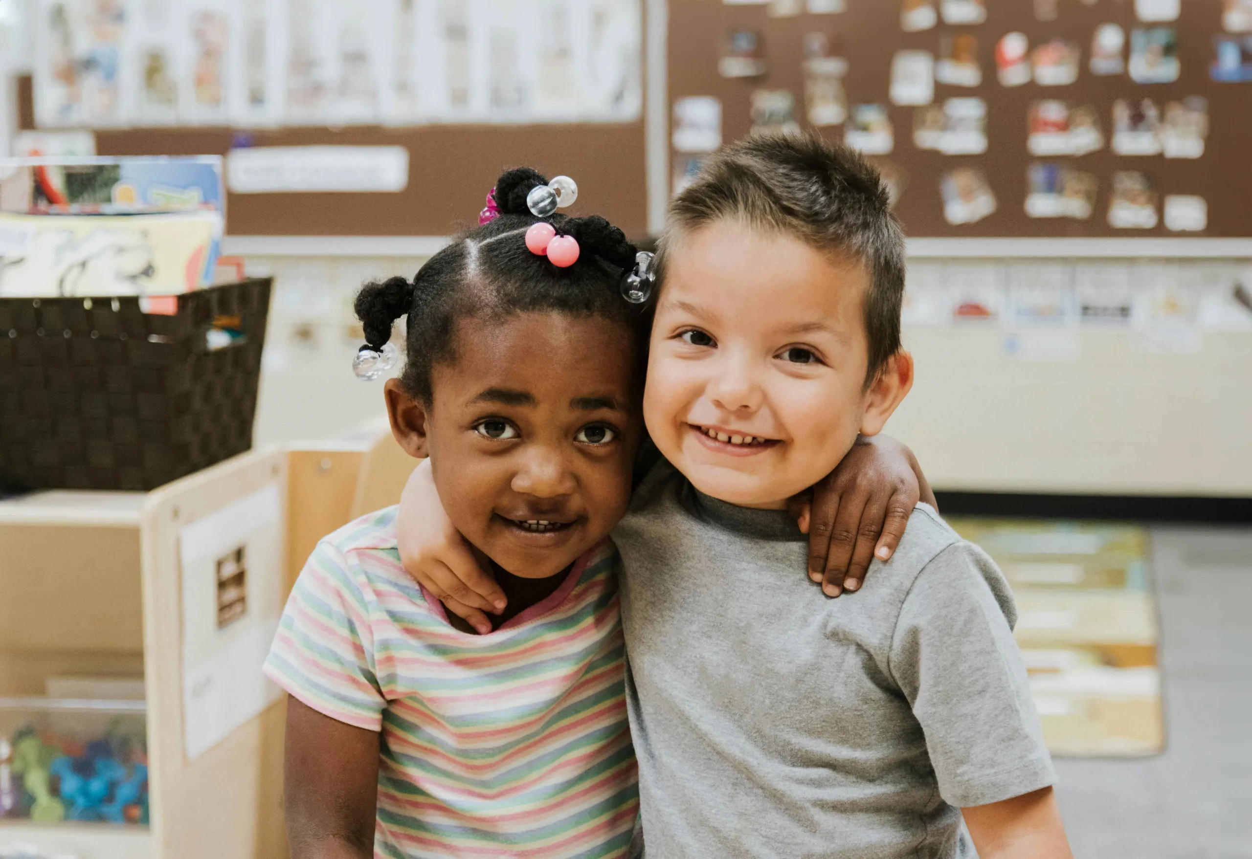 two children hugging and smiling